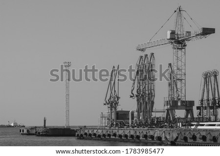 Similar – Pastel evening atmosphere at the harbor basin with cargo cranes