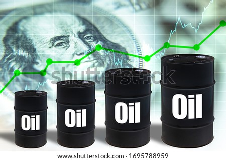 Crude petroleum. Barrels with the words oil. Symbols of increasing the cost of hydrocarbons. Concept - stocks of oil companies are growing. Franklin portrait as a symbol of value. Crude oil futures.
