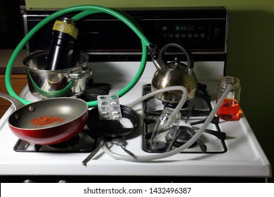 Crudely Constructed Meth Lab On A Stove Top Consisting Of Crushed Nasal Decongestant Pills, Mysterious Solutions, A Red Powder, Pots And Pans, And Hoses