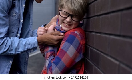 Cruel Teenager Pushing Nerd Boy To Wall, Threatening Physical Harm, Bullying