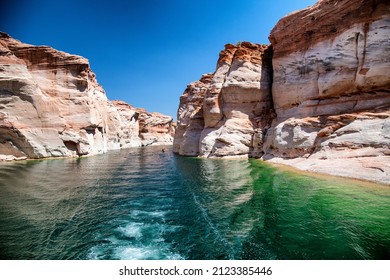 Cruise along Lake Powell. View of narrow, cliff-lined canyon from a boat in Glen Canyon National Recreation Area, Arizona. - Shutterstock ID 2123385446