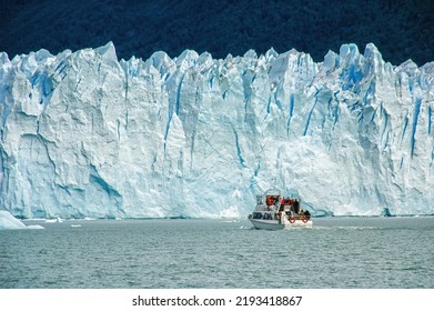 Cruise Boat In Front Of Perito Moreno Glacier In Patagonia, Argentina, South America; Guided Boat Tour On Lake