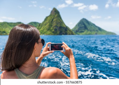 Cruise Boat Tourist Taking Mobile Phone Pictures Of Deux Pitons Peaks, St-Lucia, Caribbean. The Gros And Petit Piton, World Heritage Site. Woman On Shore Excursion From Ship In Castries, Port Of Call.