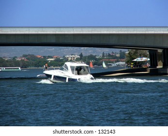 Cruise Boat Under Bridge Scene