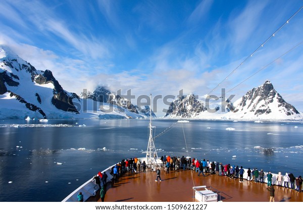 A cruise ship along the coasts of the Antarctic Peninsula, Antarctica. Lemaire Channel, Antarctic Peninsula, Antarctica - December, 2016