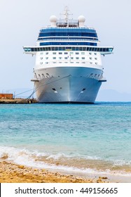 cruise ship at the berth in the port of Rhodes Greece. Front view from the shore