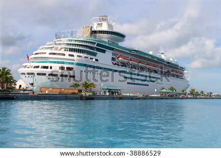 Cruise ship in the clear blue Caribbean ocean docked in the port of Nassau, Bahamas