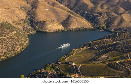 Cruise ship in Douro river and Alto Douro vineyards and landscape - UNESCO World Heritage