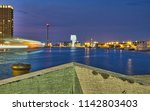 Cruise ship is leaving a dock in Antwerp, Belgium. In the background the beautiful 