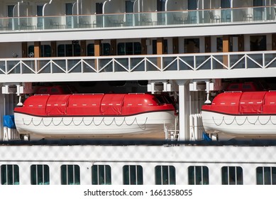 Cruise Ship Lifeboats Cradled For Safety And Emergency Drill At Sea.