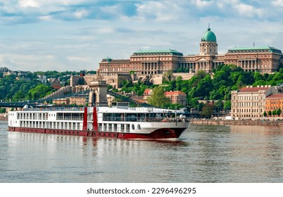 Cruise ship on Danube river with Royal palace at background, Budapest, Hungary