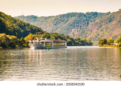 Cruise ship on the Moselle, in the background with Burg Bischofs