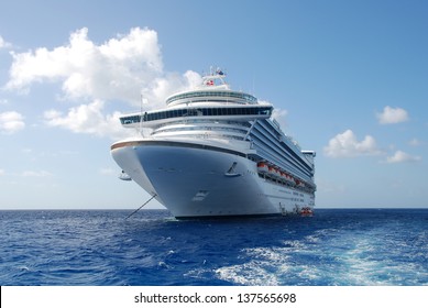 Cruise ship in open water front view