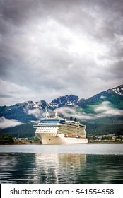 Cruise Ship At Port In Juneau, Alaska On A Cloudy Summer Day