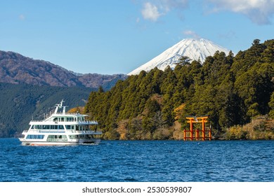 A cruise ship sails past a majestic Mount Fuji ; A scenic view o - Powered by Shutterstock