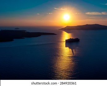 Cruise Ship Silhouette In Sunset Light With A Few Islands On Background