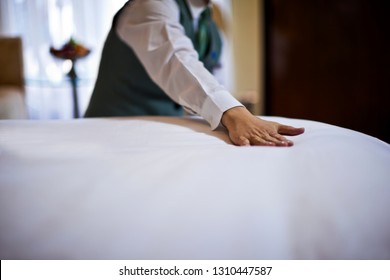 Cruise Ship Staff Member Changing Bed.