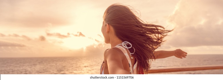 Cruise ship vacation luxury travel tourist woman enjoying freedom. Holiday tourist with open arms in front of boat feeling carefree in the tropical wind . Banner panorama.