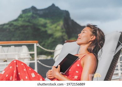 Cruise Ship Vacation Tourist Reading Book On Baconly Relaxing In The Sun Sunbathing On Lounger. Happy Asian Woman Sleeping Outside Tanning During Summer Holidays.