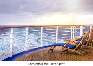 Cruise Ship Wooden Deck Chairson The Main Deck At Sunset