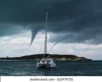 Cruising Catamaran Anchored During Storm, In The Great Abaco, Bahamas.