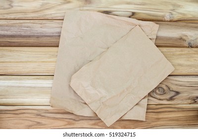 Crumbled Cooking Or Baking Paper Sheet Place On Wooden Table