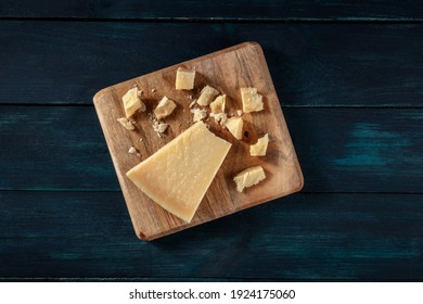 Crumbled Parmesan Cheese, Overhead Shot On A Dark Blue Wooden Background