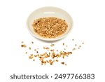 Crumbled Peanuts in a white bowl and scattered on isolated white background. Crushed Roasted Nuts, Heap of Pea Nut Crumbs. Ground, milled, crushed or granulated peanut pile isolated.