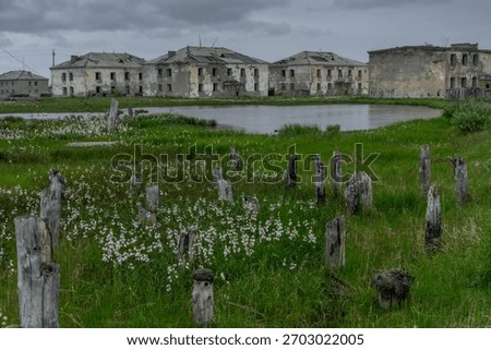 Crumbling Soviet panel blocks and debris in Ugolnye Kopi, forsaken coal town in Chukotka Autonomous Okrug, Russia.
