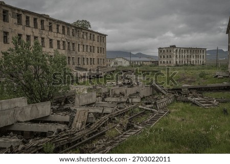 Crumbling Soviet panel blocks and debris in Ugolnye Kopi, forsaken coal town in Chukotka Autonomous Okrug, Russia.
