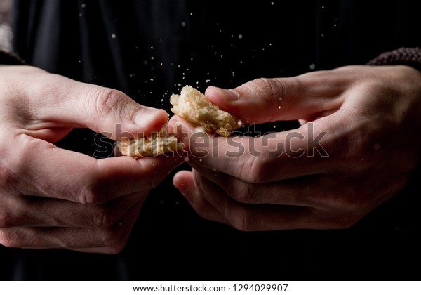 crumbs fly away,
hands break biscuits in
half