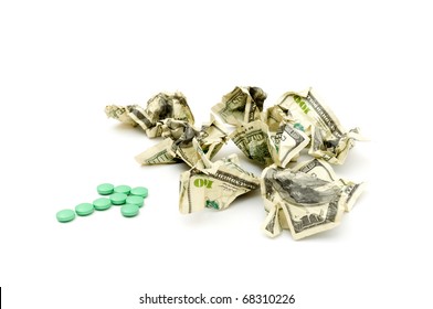 Crumpled american money and pills isolated on white
