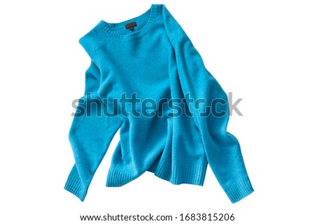 Crumpled blue wool basic sweater on white background
