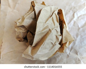 Crumpled Brown Wax Paper Wrapper In A Ball