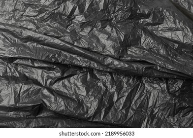 Crumpled Garbage Bag Texture Background. Trash Package Pattern, Wadded Up Plastic Bin Bags, Black Polyethylene Waste Container