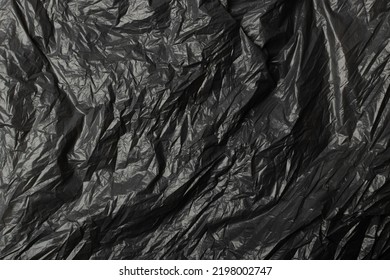 Crumpled Garbage Bag Texture Background. Trash Package Pattern, Wadded Up Plastic Bin Bags, Black Polyethylene Waste Container