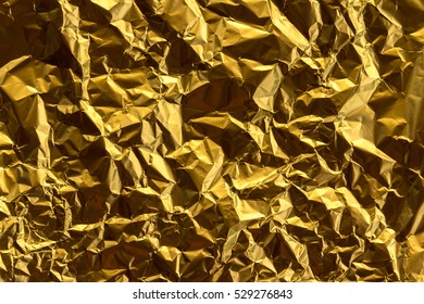 Crumpled gold foil texture background - Shutterstock ID 529276843