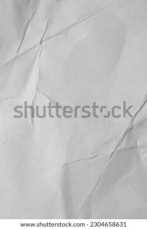 Crumpled gray cardstock paper texture background in vertical