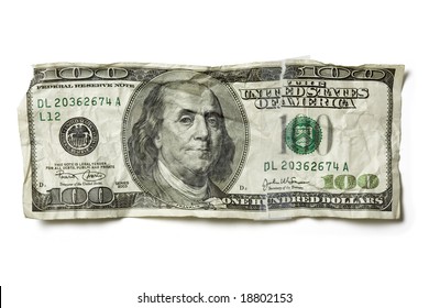 Crumpled hundred dollar bill in United States Currency, isolated on a white background