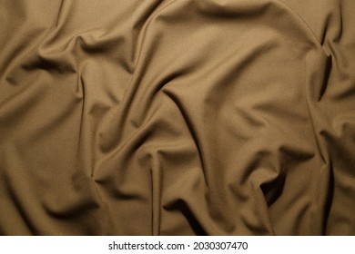 crumpled khaki tan crumpled tan khaki canvas fabric - full frame background and texture - Shutterstock ID 2030307470