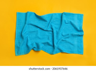 Crumpled Light Blue Beach Towel On Yellow Background, Top View