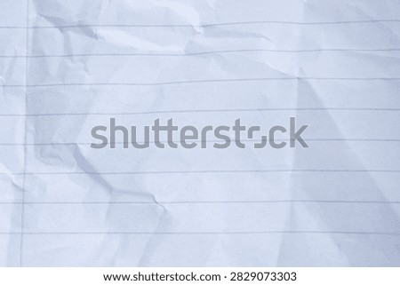 Crumpled lined paper texture with blue lines and red margin, representing mistakes, discarded ideas, or a blank slate