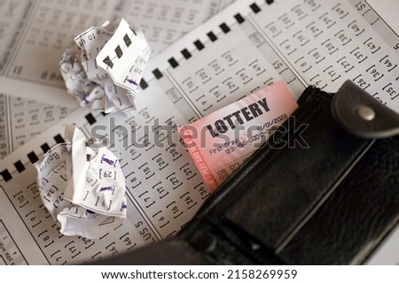 Crumpled lottery tickets and empty purse as symbol of losing the lottery game. Unlucky gambling results. Misfortune and money spending