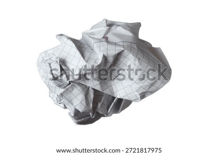 Crumpled notebook paper with grid pattern isolated on white background. Education and creative concept symbolizing errors, revisions and learning process.