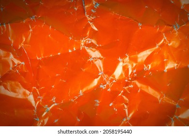 Crumpled Orange Paper Background .Close Up