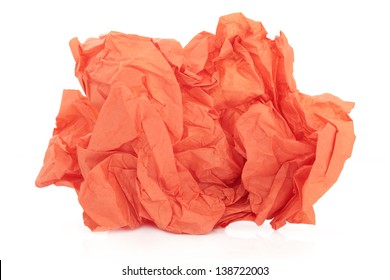 Crumpled orange tissue paper over white background.