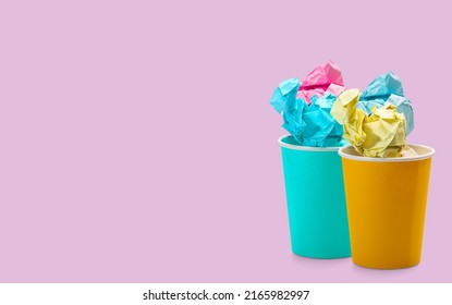 Crumpled Paper Ball On Colourful Eco Paper Cups Isolated On Pale Purple Background. Environmentally Friendly Concept.