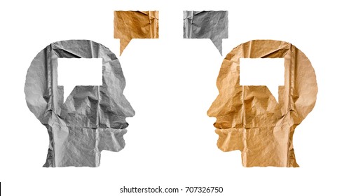 Crumpled paper shaped as a human heads and talk balloons on white background. Conversation, dialogue and opinion concept. Two heads.