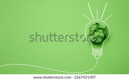 Crumpled paper sheet inside a drawn light bulb, concept of new creative idea, innovation. Copy space