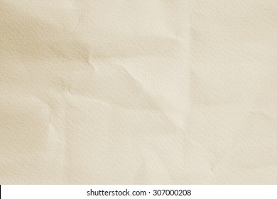 crumpled paper texture for background in sepia light tone.